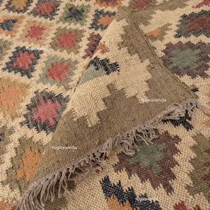 Jute Rug, Indoor Jute Rug, Wool Jute Kilim For Hallway Jute Rug Large Jute Rug, Kilim Area Rug, 8x10 Jute Rug

Handmade Navajo Kilim Rug, Aztec Rug, Accent Rug, Outdoor Rug/Indoor Rug, Living/Dinning Room 4X6 Ft. Wool Jute Kilim Rug, Indian DhurrieRug 
Jute Rug 8x10, Handwoven Jute Rug, Jute Area Rug, Flatweave Kilim Rug, 8x10 Kilim Rug, Bohemian Rug 9x12, 9x12 Wool Rug, Wool Kilim Rug

Jute Area Rug 8x10, Floral Jute Rug, Indian Traditional Jute Kilim 12x15 Large Kilim Rug, Bedroom Jute Rug