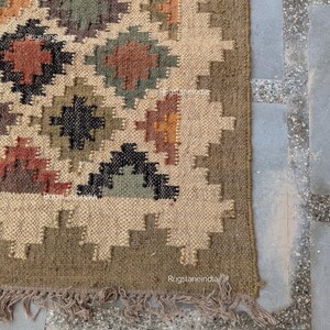 Jute Rug, Indoor Jute Rug, Wool Jute Kilim For Hallway Jute Rug Large Jute Rug, Kilim Area Rug, 8x10 Jute Rug

Handmade Navajo Kilim Rug, Aztec Rug, Accent Rug, Outdoor Rug/Indoor Rug, Living/Dinning Room 4X6 Ft. Wool Jute Kilim Rug, Indian DhurrieRug 
Jute Rug 8x10, Handwoven Jute Rug, Jute Area Rug, Flatweave Kilim Rug, 8x10 Kilim Rug, Bohemian Rug 9x12, 9x12 Wool Rug, Wool Kilim Rug

Jute Area Rug 8x10, Floral Jute Rug, Indian Traditional Jute Kilim 12x15 Large Kilim Rug, Bedroom Jute Rug
