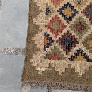 Jute Rug, Indoor Jute Rug, Wool Jute Kilim For Hallway Jute Rug Large Jute Rug, Kilim Area Rug, 8x10 Jute Rug

Handmade Navajo Kilim Rug, Aztec Rug, Accent Rug, Outdoor Rug/Indoor Rug, Living/Dinning Room 4X6 Ft. Wool Jute Kilim Rug, Indian DhurrieRug 
Jute Rug 8x10, Handwoven Jute Rug, Jute Area Rug, Flatweave Kilim Rug, 8x10 Kilim Rug, Bohemian Rug 9x12, 9x12 Wool Rug, Wool Kilim Rug

Jute Area Rug 8x10, Floral Jute Rug, Indian Traditional Jute Kilim 12x15 Large Kilim Rug, Bedroom Jute Rug