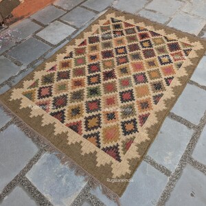 Jute Rug, Indoor Jute Rug, Wool Jute Kilim For Hallway Jute Rug Large Jute Rug, Kilim Area Rug, 8x10 Jute Rug

Handmade Navajo Kilim Rug, Aztec Rug, Accent Rug, Outdoor Rug/Indoor Rug, Living/Dinning Room 4X6 Ft. Wool Jute Kilim Rug, Indian DhurrieRug 
Jute Rug 8x10, Handwoven Jute Rug, Jute Area Rug, Flatweave Kilim Rug, 8x10 Kilim Rug, Bohemian Rug 9x12, 9x12 Wool Rug, Wool Kilim Rug

Jute Area Rug 8x10, Floral Jute Rug, Indian Traditional Jute Kilim 12x15 Large Kilim Rug, Bedroom Jute Rug