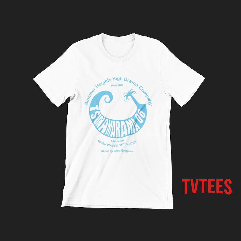 May include: White t-shirt with a blue graphic design. The design includes the text "TSUNAMARAMA 06" in a curved font, along with the text "Summer Heights High Drama Company presents" and "A Musical WHEN WAVES GET DEADLY".