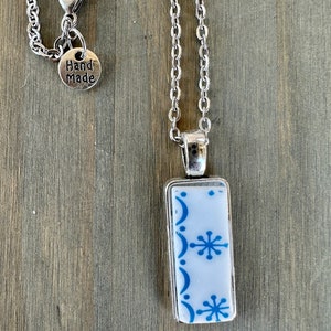 Broken China Jewelry, made out of a Vintage 1970s Correlle Plate “Snowflake Blue” on Silver pendant