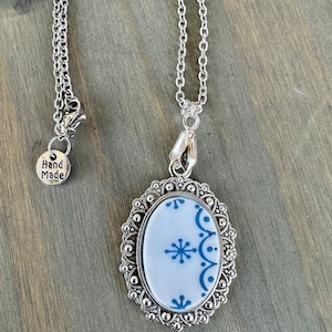 Broken China Jewelry, made out of a Vintage 1970s Correlle Plate “Snowflake Blue” on Silver pendant
