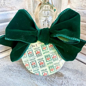 Handmade 1960s S & H Stamp ornament with green velvet bow