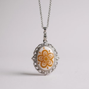 Handmade and repurposed using a vintage 1970s Correlle “Butterfly Gold” Pendant Necklace on Silver Bezel