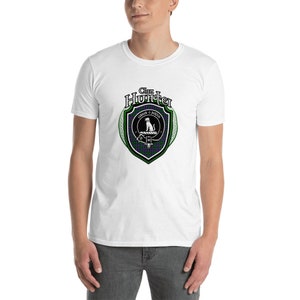 May include: White t-shirt with a green, blue, and white clan crest featuring a dog and the text "Clan Hunter" in a black circle.