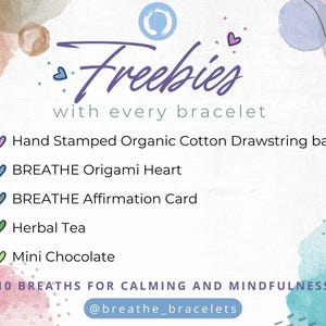 May include: Promotional graphic with the word "Freebies" in purple script, listing items included with a bracelet purchase. Items include a drawstring bag, origami heart, affirmation card, herbal tea, and mini chocolate. The text also includes the phrase "10 BREATHS FOR CALMING AND MINDFULNESS" and an Instagram handle.