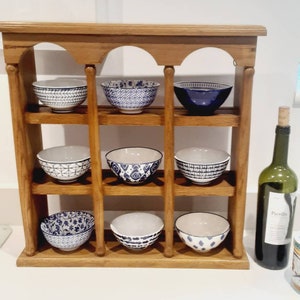 Solid Oak display stand in wonderful architectural style. Various uses for display of spice jars, cactus, cups and saucers, collections.