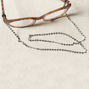 attache lunette acier inoxydable argentée (la paire)