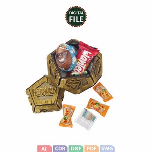 May include: A wooden box with a spiderweb design and the words "Happy Halloween" on the front. The box is open and filled with candy, including a chocolate candy with a face, a red candy bar, and a few orange candies.