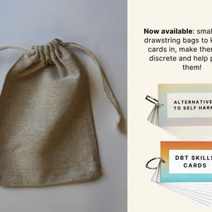 May include: A set of two small card decks with a rainbow gradient background. The decks are titled "Alternatives to Self Harm" and "DBT Skills Cards". The cards are packaged in a small, beige canvas drawstring bag.