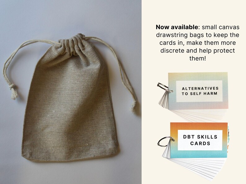 May include: A set of two small card decks with a rainbow gradient background. The decks are titled "Alternatives to Self Harm" and "DBT Skills Cards". The cards are packaged in a small, beige canvas drawstring bag.