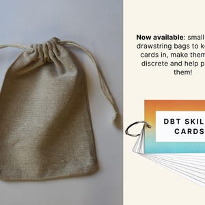 May include: A natural canvas drawstring bag with a light beige color. The bag is filled with a set of DBT Skills Cards. The cards have a gradient design with orange, yellow, and blue colors. The text "DBT SKILLS CARDS" is printed in black on the cards.