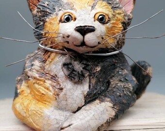 tortoiseshell cat ceramic sculpture