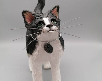 Black and white cat ceramic sculpture