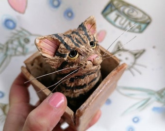 Ceramic tabby cat sculpture