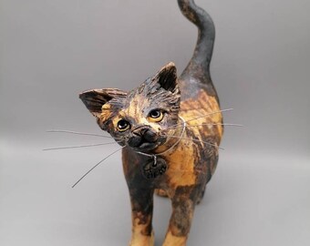 Ceramic tortoiseshell cat sculpture