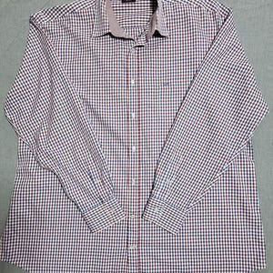May include: A long-sleeved shirt with a red, blue, and white check pattern. The shirt has a classic collar and buttoned cuffs. The collar lining has a contrasting pattern. The shirt is buttoned down the front.