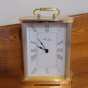 Vintage Jean Louis-klok met glazen voorkant werkt op batterijen Mantel