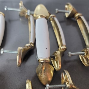 Vintage brass and porcelain cupboard or drawer pulls