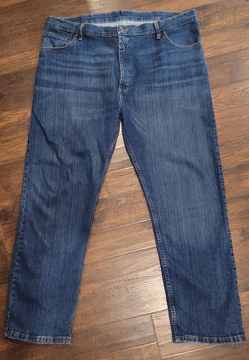 May include: A pair of dark blue denim jeans with a classic straight leg fit.