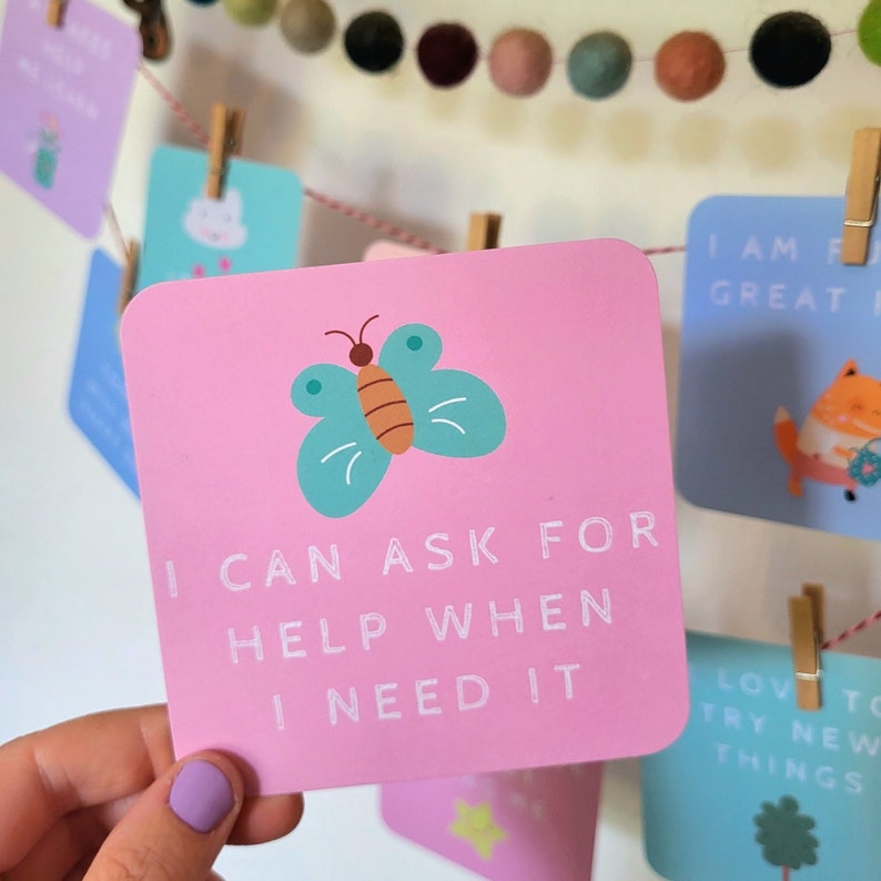 May include: Pink affirmation card with a teal butterfly illustration and the text "I can ask for help when I need it".