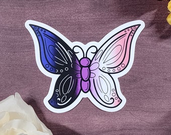 Könnte beinhalten: Ein Aufkleber mit einem Schmetterling, dessen Flügel in Blautönen, Schwarz, Lila, Rosa und Weiß gehalten sind. Der Schmetterling ist mit einer schwarzen Umrandung versehen.