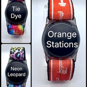 May include: Smartwatch bands in three designs: tie-dye, neon leopard, and orange with white stripes. Each band is attached to a black smartwatch face. The text "Tie Dye", "Orange Stations", and "Neon Leopard" are displayed on the watch faces.