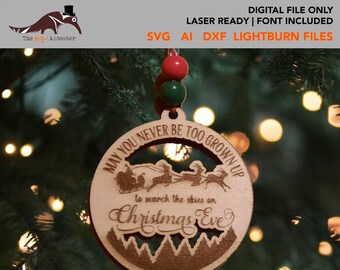 May include: A wooden Christmas ornament with the text "May you never be too grown up to search the skies on Christmas Eve". The ornament features a silhouette of Santa's sleigh flying through the air.