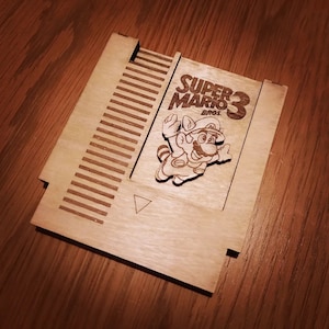 マリオにインスパイアされた NES 木製レトロゲームカートリッジが英国で発売