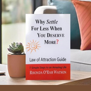 May include: A white book with a yellow sun graphic and the title "Why Settle For Less When You Deserve More? Law of Attraction Guide 7 Simple Steps to an Amazing Life Rhonda O'Rah Watson"