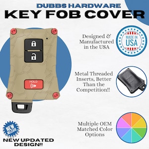 May include: Tan key fob cover with red accents and the text "HOLD". The cover has a textured design and includes the text "DUBBS HARDWARE KEY FOB COVER". The image also includes the text "Designed & Manufactured in the USA".
