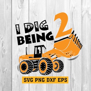 May include: A graphic design featuring an orange digger with the text "I DIG BEING 2". The design includes a large number 2 and the words "SVG PNG DXF EPS" in a yellow rectangle.