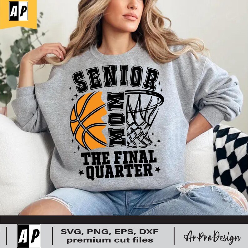 May include: A grey sweatshirt with the text "Senior Mom The Final Quarter" in black. A basketball and a basketball hoop are split in half and form the "O" in "Mom".
