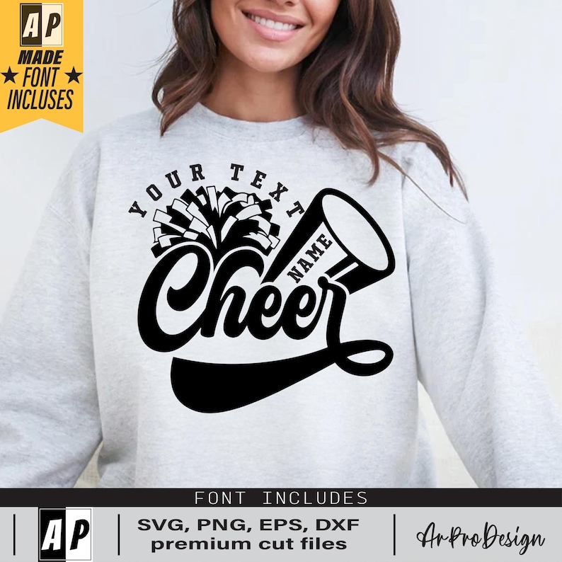 Peut inclure: Un sweat-shirt gris avec un motif noir et blanc de m&eacute;gaphone de pom-pom girl et de pompons. Le texte "YOUR TEXT NAME Cheer" est inclus dans le motif.