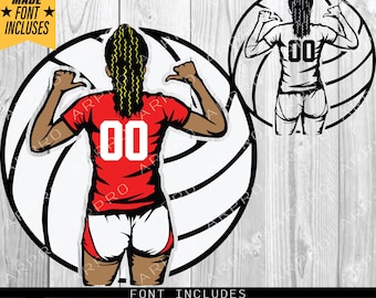 May include: A black and white volleyball with a red and white jersey on top. The jersey has the number "00" on the front. The volleyball is on a wooden background.