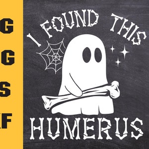 May include: A white ghost holding a bone with the text "I found this humerus" written in white bone-shaped letters on a black chalkboard background.