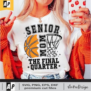 May include: White t-shirt with a black basketball and hoop graphic. The text "Senior Mom The Final Quarter" is printed on the shirt.