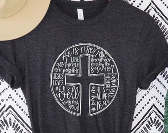 Él ha resucitado camisa, cruz con camisa de palabras, camisa de Pascua, camisa de Pascua de Jesús, camisa de Pascua para las mujeres, camisa cristiana, camisa de Pascua feliz