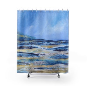 May include: A shower curtain featuring an abstract landscape painting. The artwork uses shades of blue, gold, and brown to depict a coastal scene. The top portion of the curtain is a light blue, transitioning to darker blues and browns at the bottom.