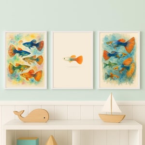 May include: Three framed watercolor prints featuring colorful guppy fish. The prints showcase various guppy fish with vibrant blue, orange, yellow, and green hues. The artwork is set against a soft, watercolor background, creating a whimsical and artistic aesthetic.