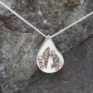 Solid silver teardrop pendant, handmade organic texture, copper spheres and copper infill.