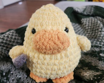 handmade/crocheted yellow cuddly duck.