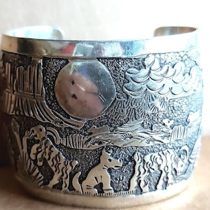 Vintage 18 cm. (2&quot;) Sterling Silver Navaho-style bracelet with carved figures depicting a southwest storyline