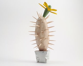 a cactus, wood sculpture, a sculpture made by hand, looks beautiful on a shelf or on a window sill, does not require watering :)