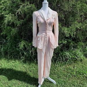1980s Foxy Lady pastel pink and white elegant funky retro button up peplum jumpsuit