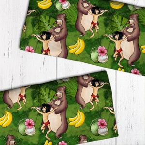 May include: A repeating pattern featuring a cartoon bear, a young boy, bananas, coconuts, and tropical flowers on a green background. The design has a jungle theme with a white wooden surface in the background.
