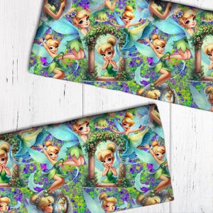 May include: A green and blue fabric with a repeating pattern of Tinkerbell fairies. The fairies are flying, sitting, and looking in a mirror. The background is a green and purple swirl.