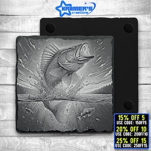 May include: Black and white engraved image of a fish leaping out of the water. The fish has a large mouth and fins. The image is on a black slate coaster.