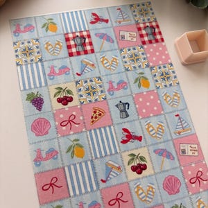 May include: A patterned design with summer-themed illustrations. The design includes pink scooters, lemons, cherries, pizza slices, seashells, and sailboats. The background is a mix of light blue, pink, and white patterns, including stripes and polka dots.